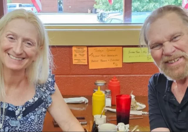 Debra Marshal and Hacksaw Jim Duggan dining in North Dakota