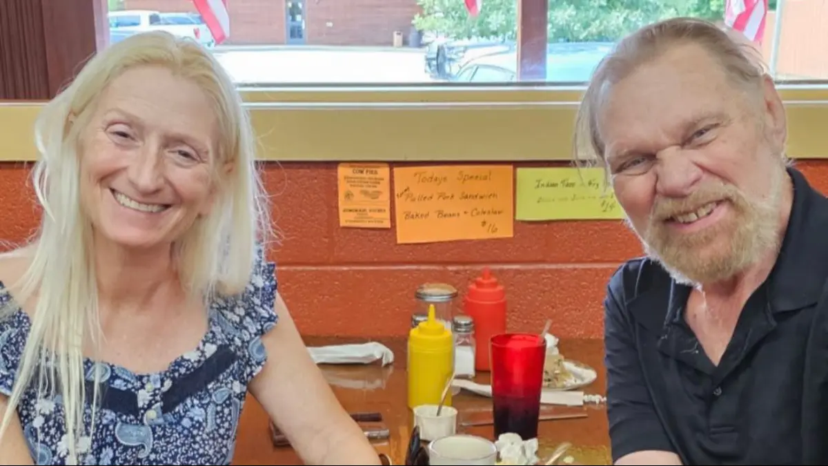 Debra Marshal and Hacksaw Jim Duggan dining in North Dakota
